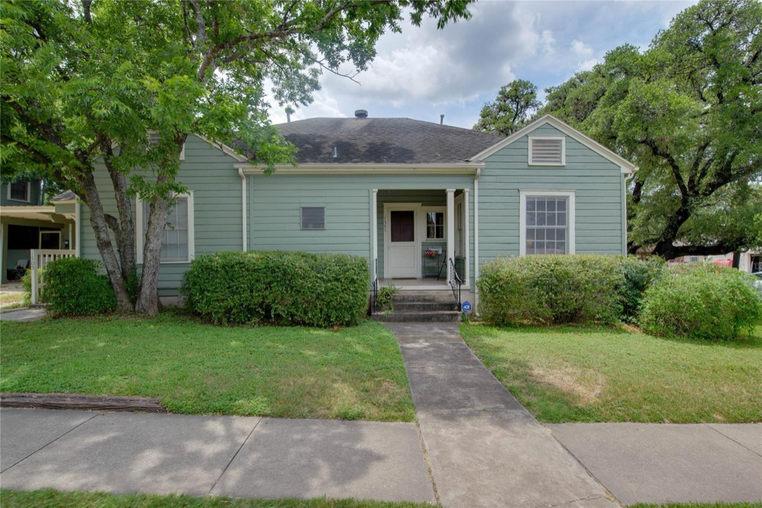 1505 W. 12th Street — the single-story green craftsman building front view