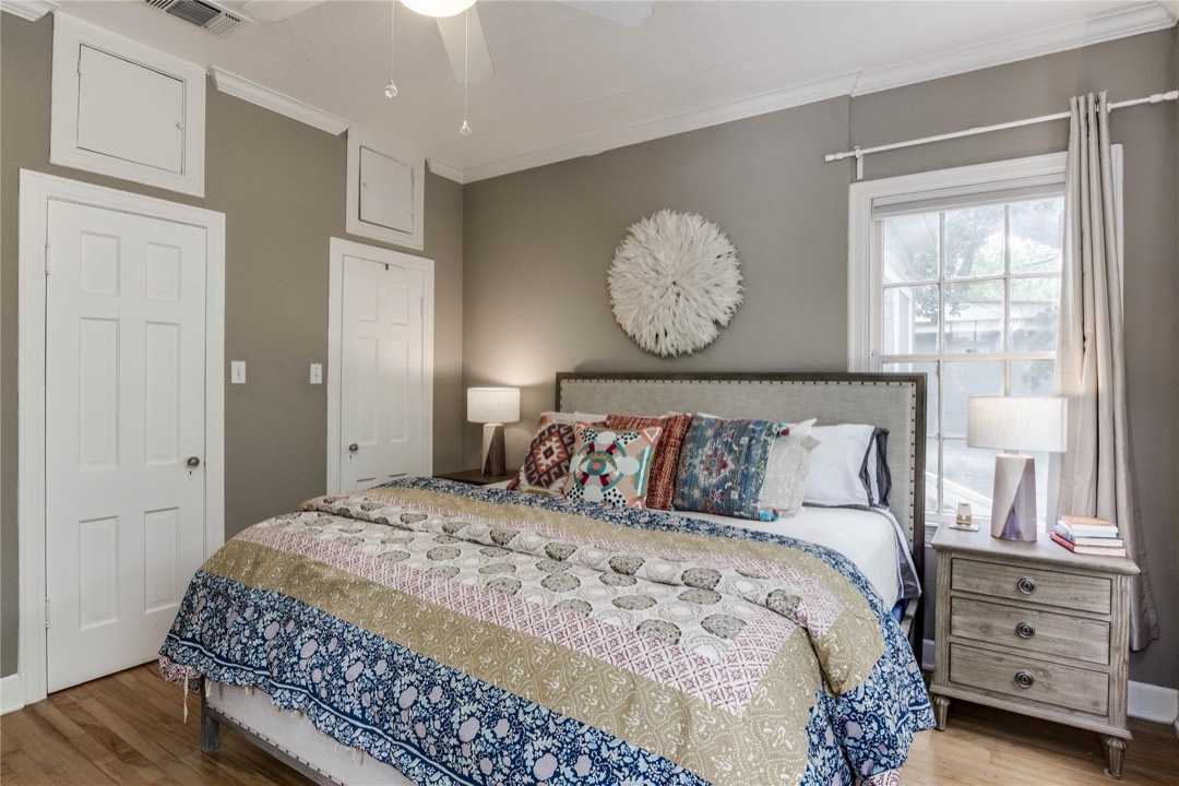 Bedroom with hardwood floors, ample closet space and natural light