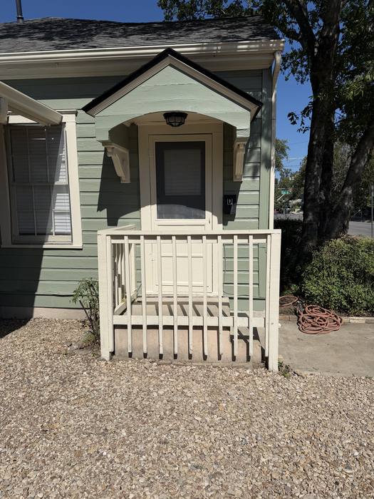 Private covered front porch of Unit D at 1505 W. 12th Street